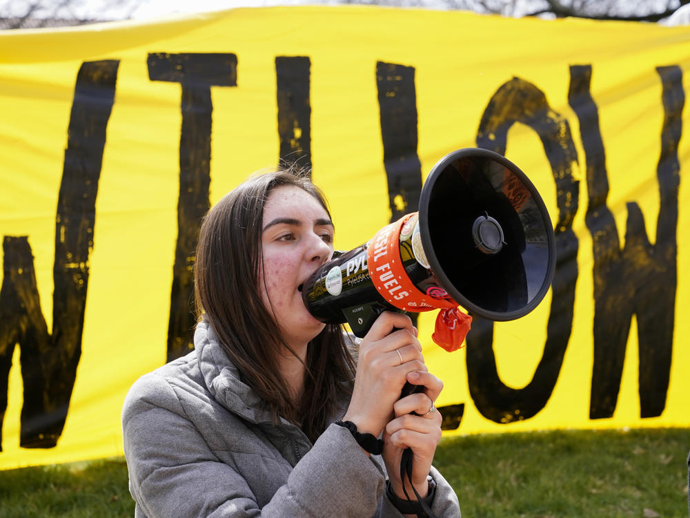 A demonstrator protests against the Biden administration's approval of the Willow oil project in Washington, Tuesday, March 21, 2023.