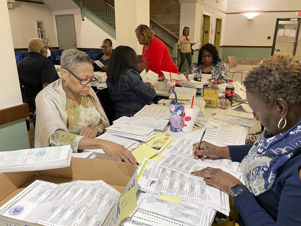 An election resolution board counts absentee ballots Wednesday, Nov. 8, 2023, at the Hinds County Courthouse in Jackson, Miss.