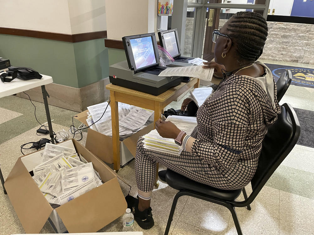 An election resolution board counts absentee ballots Wednesday, Nov. 8, 2023, at the Hinds County Courthouse in Jackson, Miss.