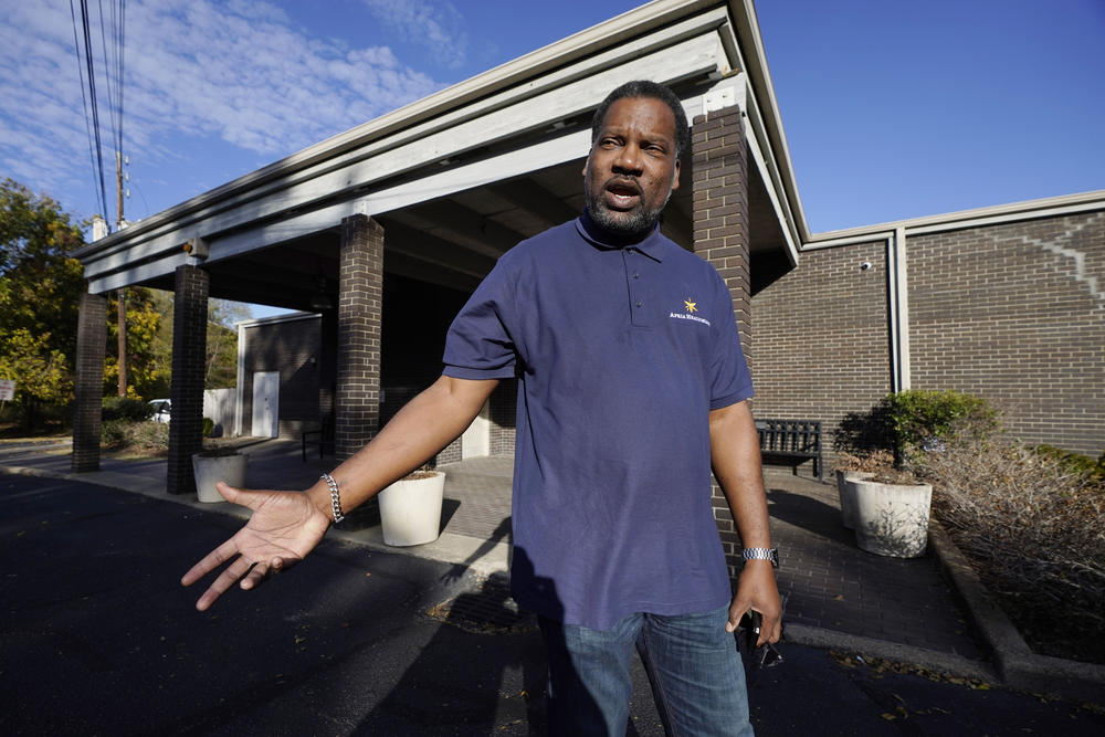 Otis Wells, 51, stands in front of his Clinton, Miss., precinct, Wednesday, Nov. 8, 2023, recalling how he, his wife and son had to wait in line for almost an hour to vote, since the precinct ran out of paper ballots mid-afternoon, during Tuesday's general election.
