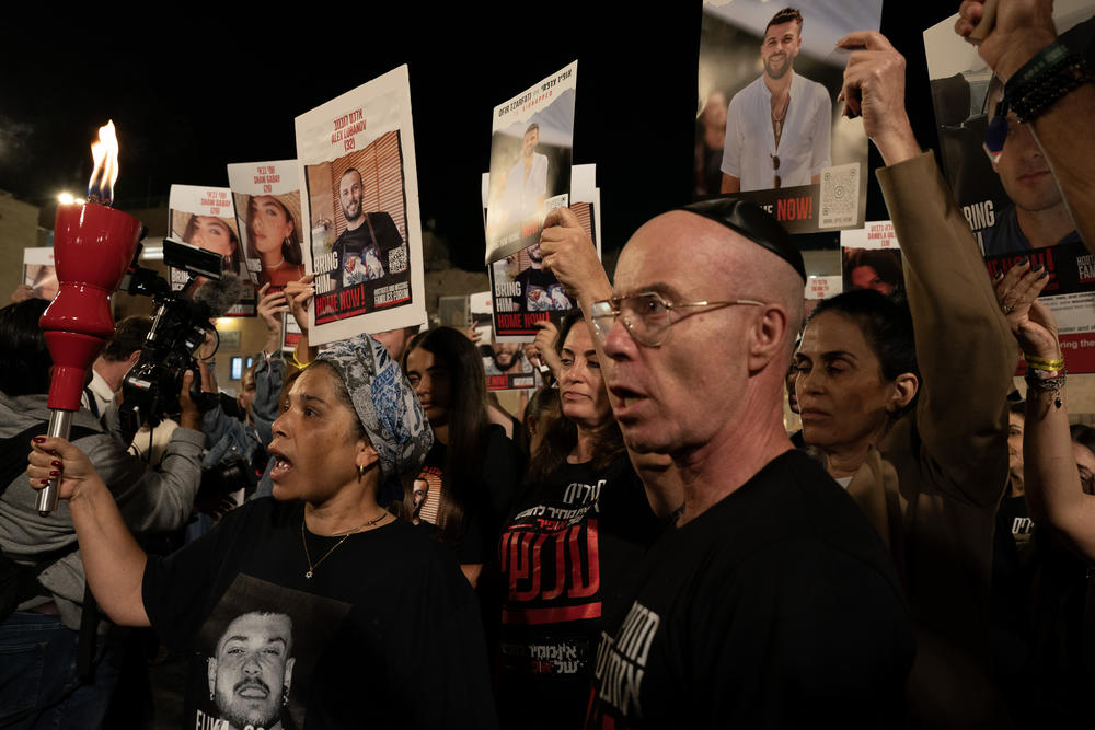 Family members of people kidnapped from southern Israel by Hamas on Oct. 7 call for an immediate hostage release deal at the Western Wall, one month after the attacks, on Tuesday, in Jerusalem.