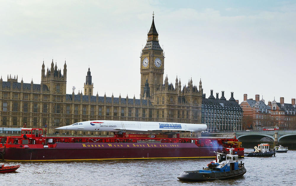 The last decommissioned Concorde sails down the River Thames and past Britain's Houses of Parliament on April 13, 2004, en route to its new home at the National Museum of Flight in Scotland.
