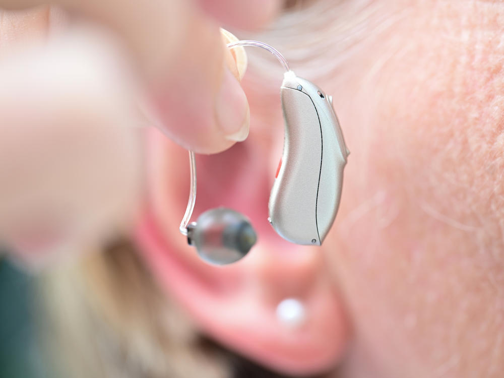People who consistently wear hearing aids have a lower chance of falling, a new study finds.