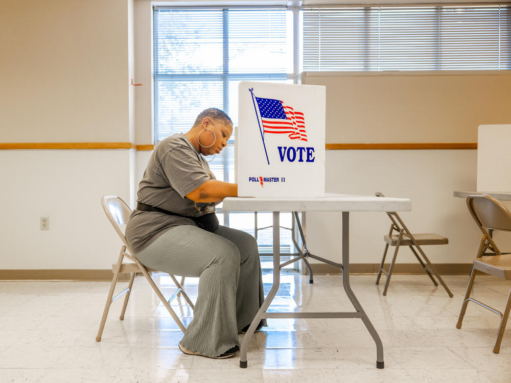 A voter fills out a ballot in Jackson, Miss., on Tuesday. Federal and local officials have worked closely with researchers to track rumors and conspiracy theories in recent elections but that cooperation is fading under pressure from conservatives.