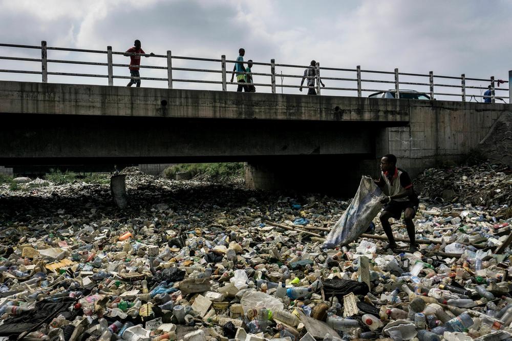 Plastic bottles cover the Kalamu River in the Democratic Republic of Congo in 2018.