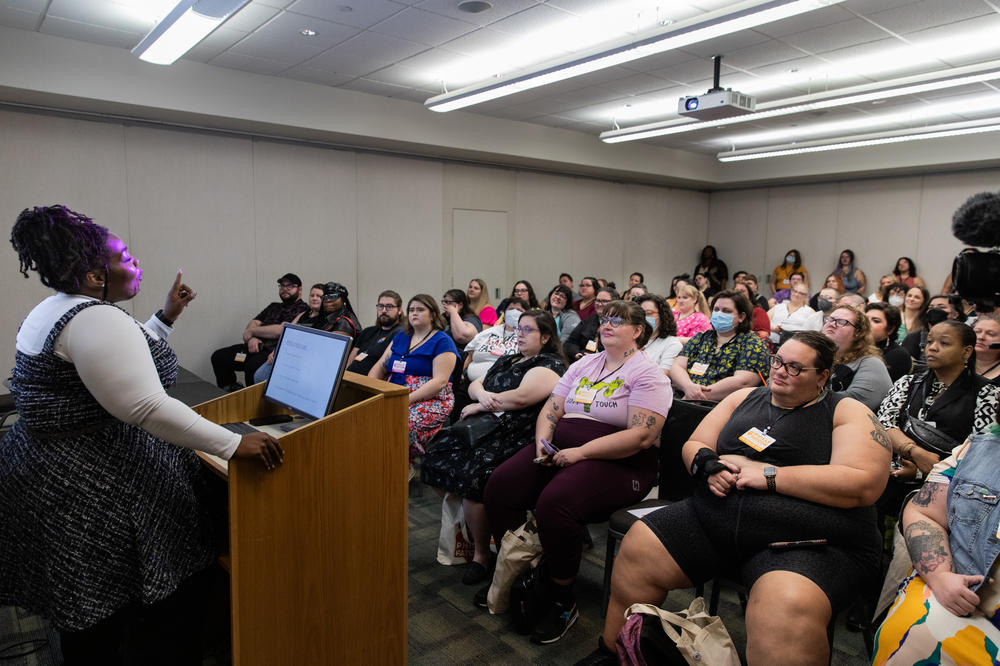 Attendees listen to a presentation by Joy Cox, the author of <em>Fat Girls in Black Bodies: Creating Communities of Our Own</em>.