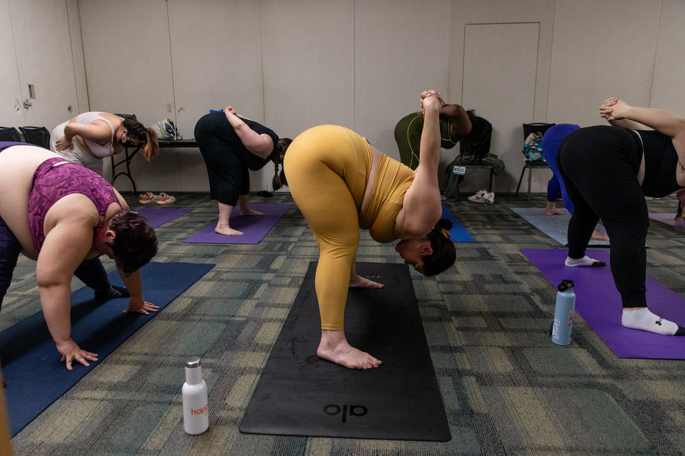 Attendees participate in the breathe and flow yoga class at Philly FatCon last month. During the session, instructor Laura Zales spoke about taking up space and proper weight distribution. Attendees ranged in age, size and gender.