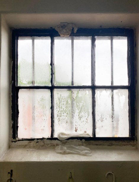 Feminine hygiene products are used to absorb water entering a single-level housing unit through an insufficiently sealed exterior window.