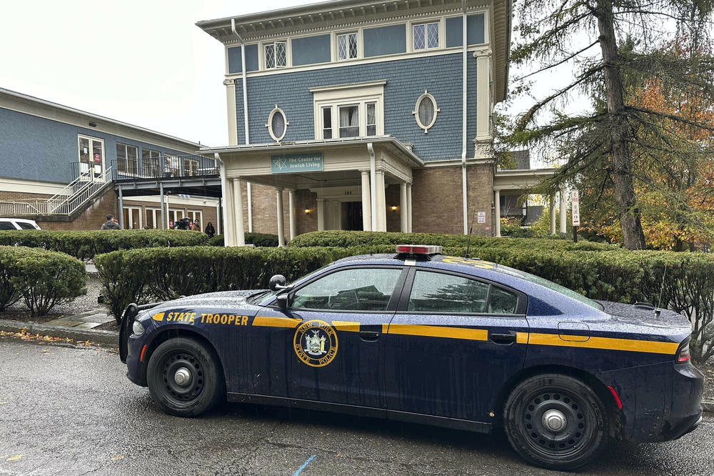 A New York State police cruiser is parked in front of Cornell University's Center for Jewish Living, in Ithaca, N.Y., on Oct 30. Threatening statements about Jews on an internet discussion board have unnerved students.