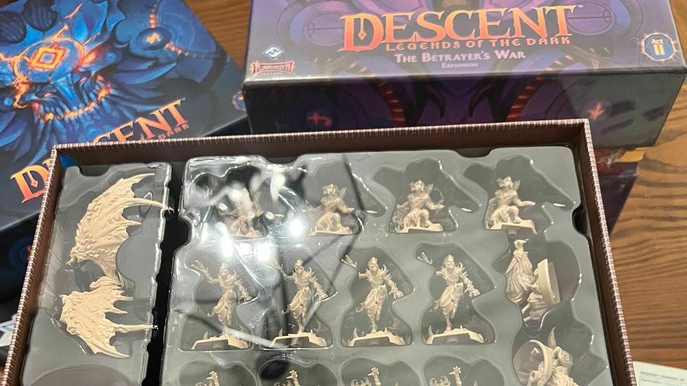 Descent's giant boxes and the dozens of miniatures contained therein.