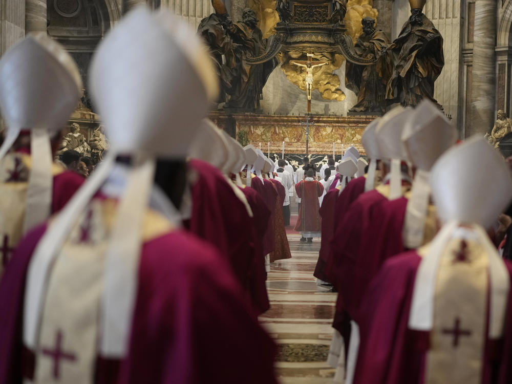 Cardinals and bishops arrive in procession at a mass in St. Peter's Basilica at the Vatican in Rome.