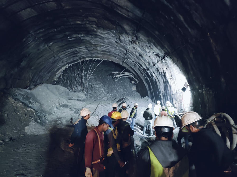 This photo provided by Uttarakhand State Disaster Response Force shows rescuers inside a collapsed road tunnel where 40 workers were trapped by a landslide in northern in Uttarakhand state, India,on Sunday.