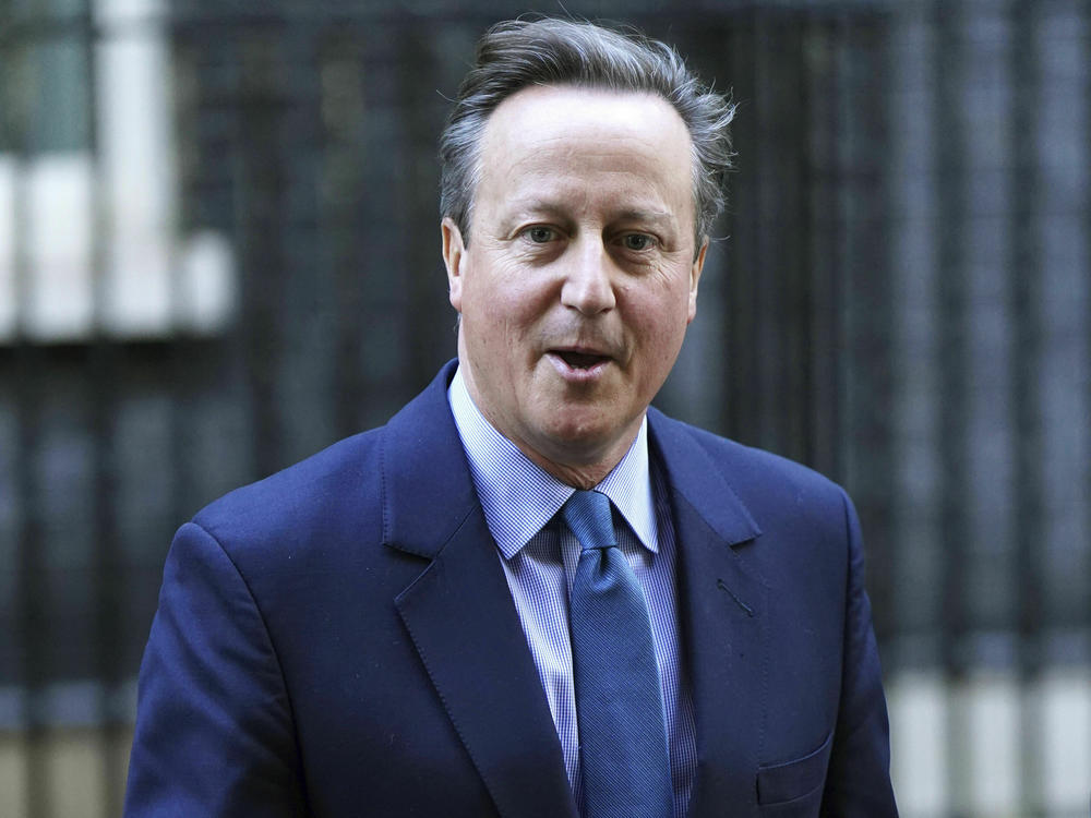 Britain's former prime minister David Cameron leaves Downing Street in London on Monday.