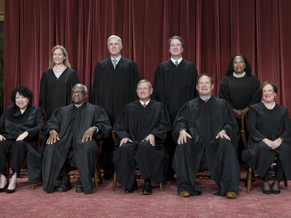Members of the Supreme Court sit for a group portrait following the addition of Associate Justice Ketanji Brown Jackson last October.