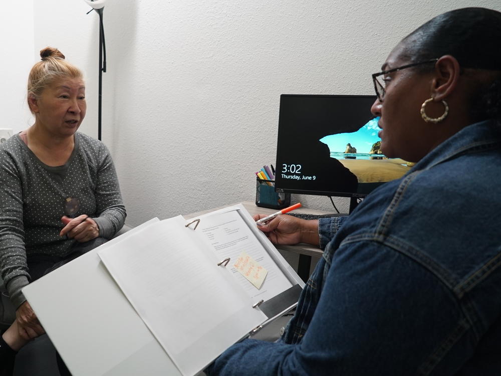 Adrianna Wilson (right) works with Jennifer Park to provide supportive services at the Illumination Foundation's Navigation and Recuperative Care Center in Fullerton, California.