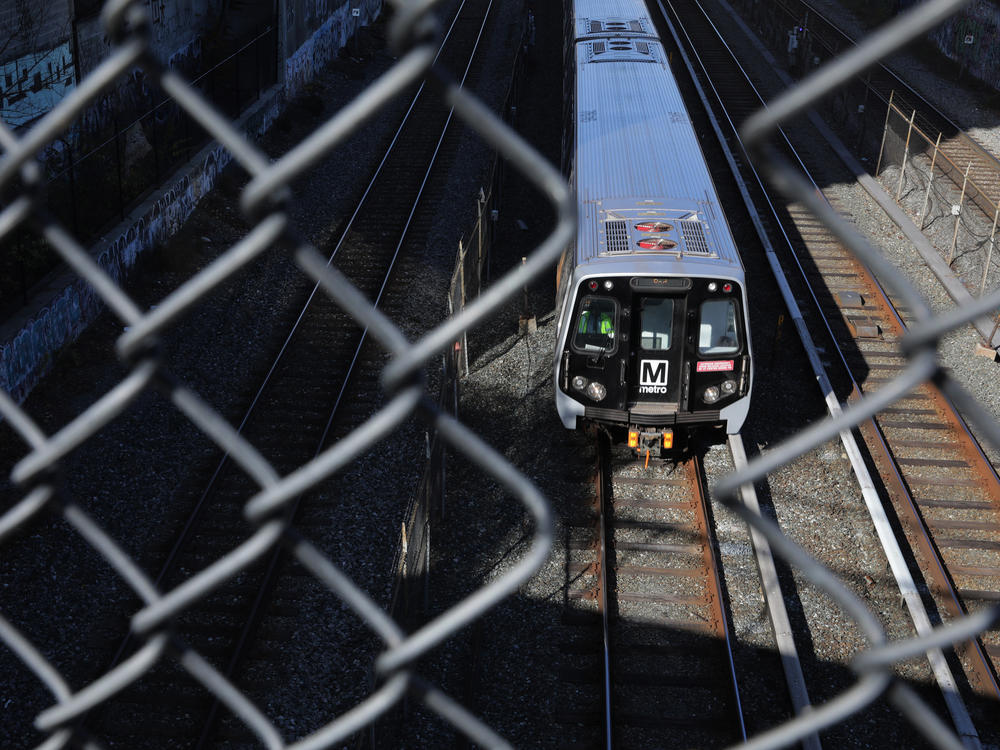 A Metro train car travels along the Red Line in Washington, D.C. Since the COVID-19 pandemic, riders have slowly returned to taking mass transit.