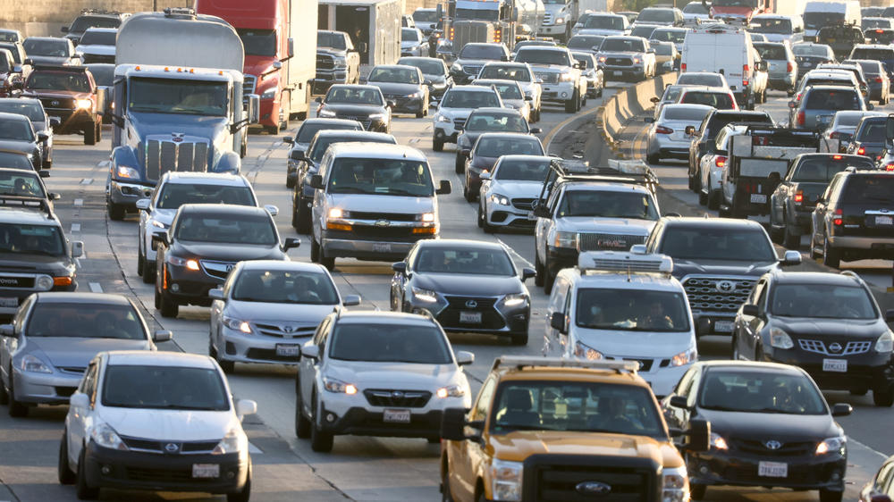 Heavy afternoon traffic moves along the I-5 freeway in Los Angeles. The more people that take mass transit, the less-crowded roads like this one can become. That benefits motorists and transit riders alike.