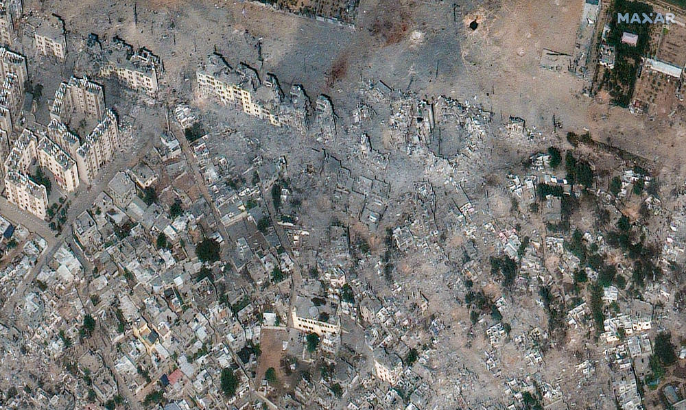 Maxar satellite imagery shows damage to the 'Izbat Beit Hanoun neighborhood in Northern Gaza on Oct. 21, 2023.
