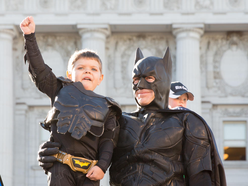 Batkid Miles Scott, center, received a key to the city from San Francisco Mayor Ed Lee, left, on Nov. 15, 2013.