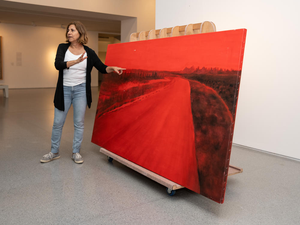 Rescued from her studio in Kibbutz Be'eri near Israel's border with Gaza, artist Ziva Jelin's damaged painting <em>Curving Road </em>is currently on special display in the Israeli Art gallery of the Israel Museum in Jerusalem.