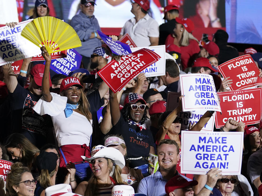 Attendees show their support for former President Donald Trump during a campaign rally in Hialeah, Fla., on Nov. 8.