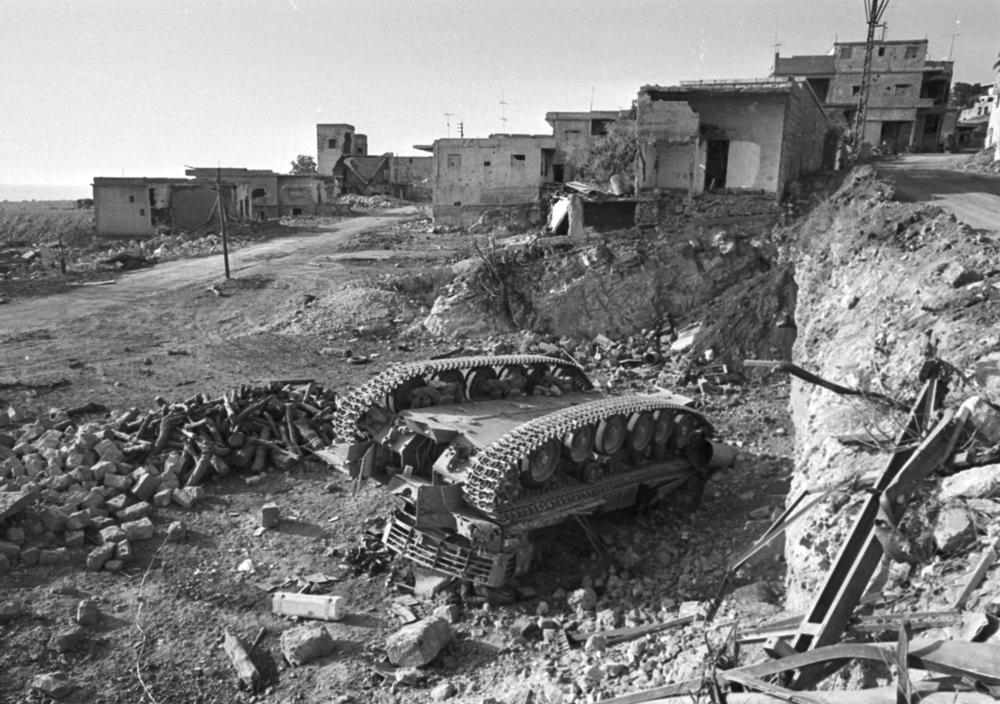 An Israeli tank seen overturned by the Damour highway in Lebanon, on June 17, 1982. Israel occupied southern Lebanon from 1982 to 2000.