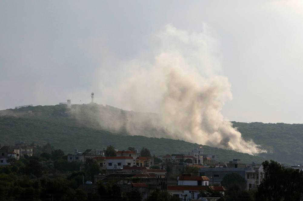 Smoke billows following Israeli artillery bombing on the outskirts of the Lebanese border village of Aita al-Shaab on Oct. 9.