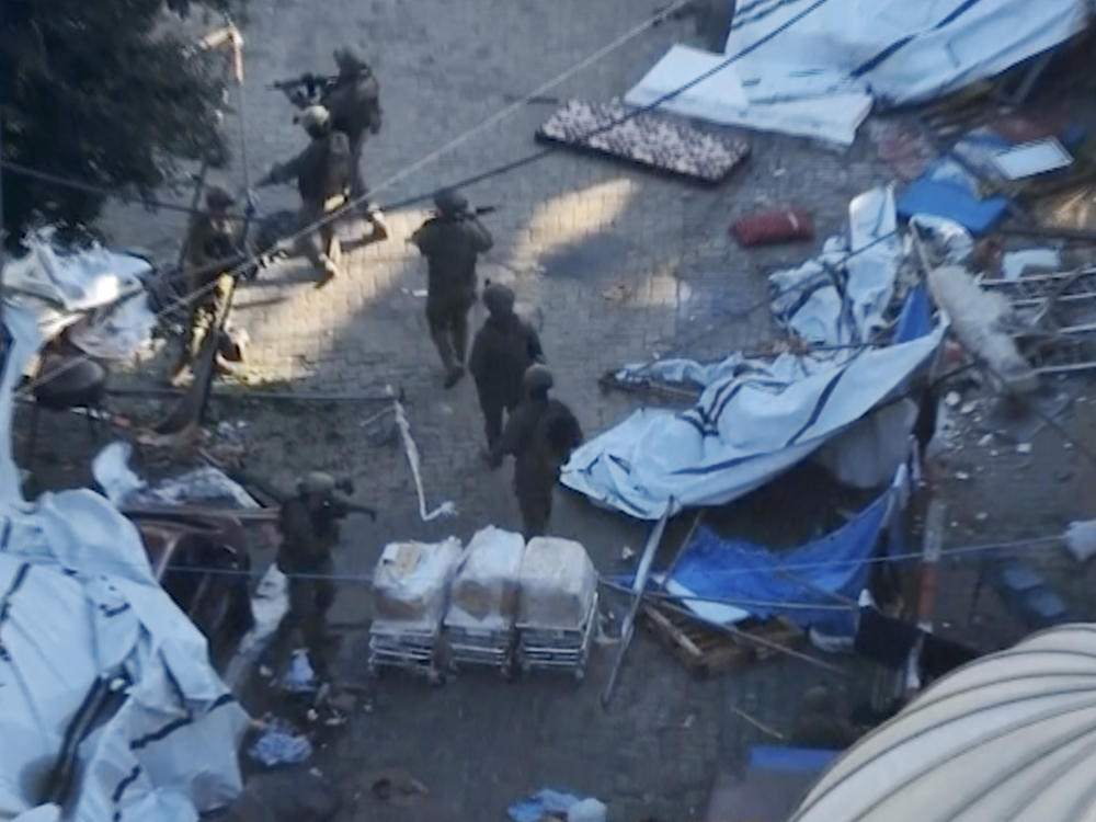Israeli troops operate on the grounds of the Al-Shifa hospital in Gaza City in this photo released by the Israeli military. The Israelis say they found weapons belonging to Hamas, but did not provide details. Hamas denied the claim that it has been operating in or underneath the hospital.