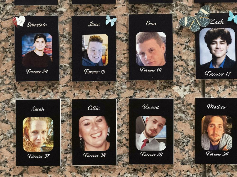 Photographs of people who had died from drugs are on display during the Second Annual Family Summit on Fentanyl at DEA Headquarters in Washington, Tuesday, Sept. 26, 2023. (AP Photo/Jose Luis Magana)