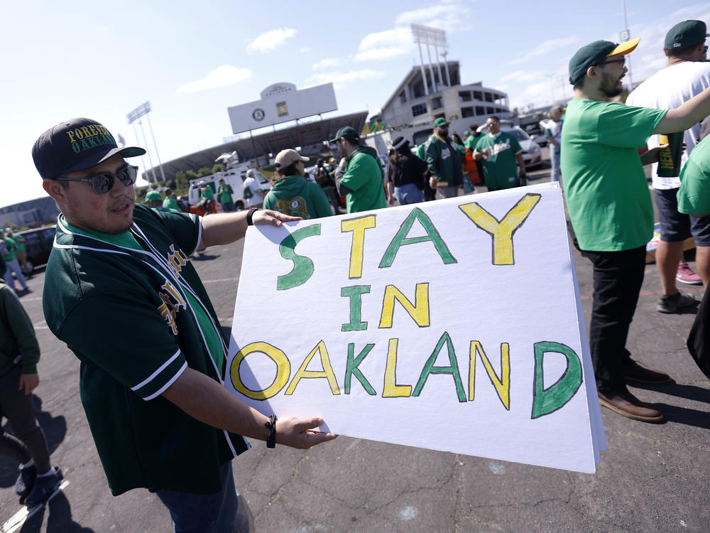 Reuben Ortiz of Modesto, Calif., holds a sign outside Oakland Coliseum to protest the Oakland Athletics' planned move to Las Vegas before the A's game with the Tampa Bay Rays on June 13, 2023. The Athletics' move to Las Vegas was unanimously approved Thursday, Nov. 16, 2023 by Major League Baseball team owners.