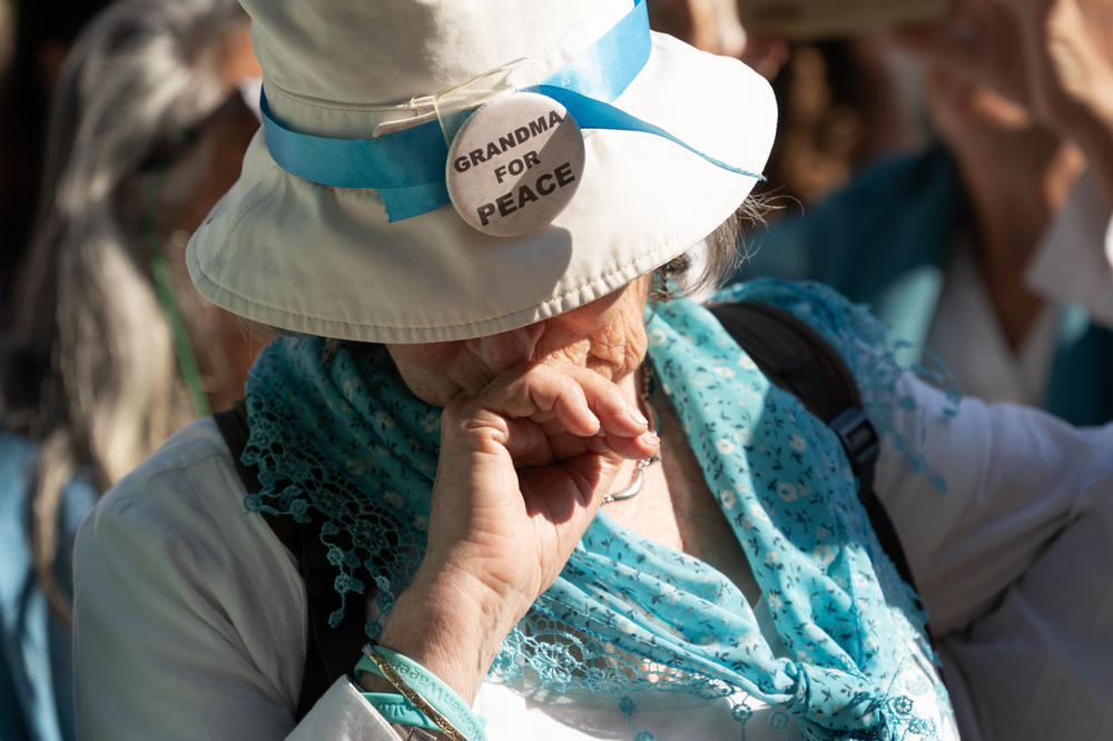 A mourner reacts during Vivian's funeral service Thursday.