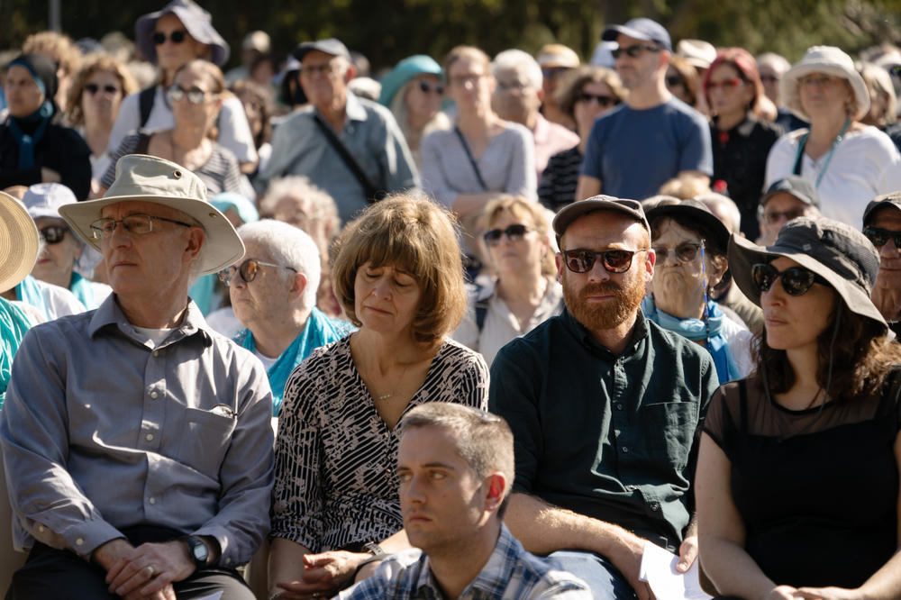 Vivian Silver's family listens to eulogies during a service on Thursday. Silver, who had been missing and presumed to be a hostage since Hamas' attacks on Oct. 7, was confirmed dead this week after her DNA was found in the ashes of her home.