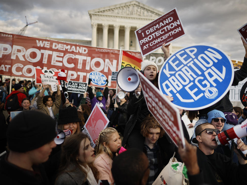 Anti-abortion and abortion rights activists protest during the 50th annual March for Life rally in front of the U.S. Supreme Court on Jan. 20, 2023 in Washington, D.C.