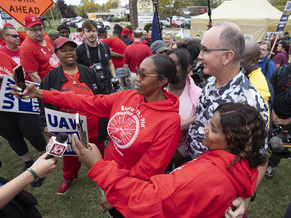 United Auto Workers President Shawn Fain posed with UAW members as they strike the General Motors Lansing Delta Assembly Plant in Michigan in late September.
