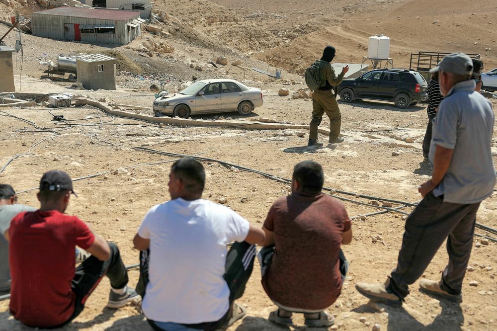 An Israeli soldier patrols the Palestinian Bedouin village of Tala (Thala) in the occupied West Bank on Oct. 26, 2023, following an attack by Israeli settlers on residents that same day.