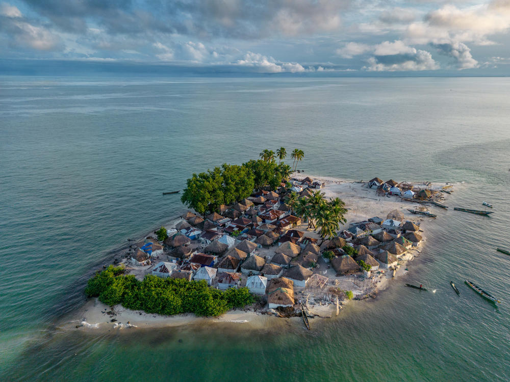 An aerial view of the remnants of Nyangai Island, Sierra Leone, once home to three villages and a thriving community, but now all but disappeared due to rampant erosion driven by worsening climate change and rising sea levels.