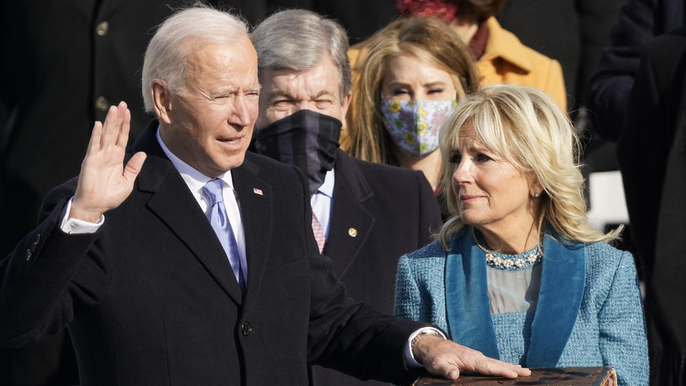 Joe Biden is sworn in as the 46th president of the United States by Chief Justice John Roberts as Jill Biden holds the Bible during the 59th Presidential Inauguration at the U.S. Capitol in Washington, Jan. 20, 2021.