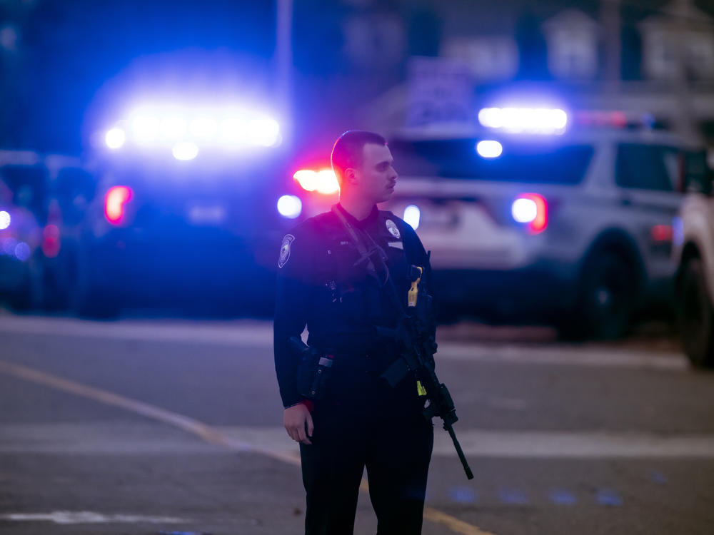 Police work outside the New Hampshire Hospital where officials said several people were shot on Friday.