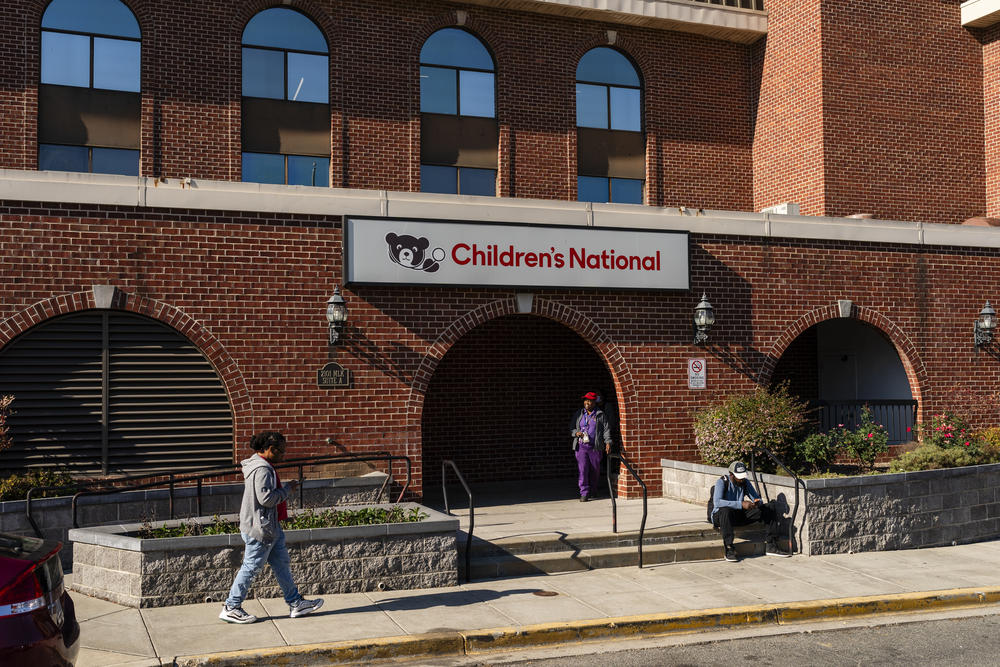 People walk past Children's National's Anacostia clinic in Washington, D.C. on November 16, 2023. In a growing number of institutions around the country, lawyers are teaming up with doctors in an effort to help patients overall health.