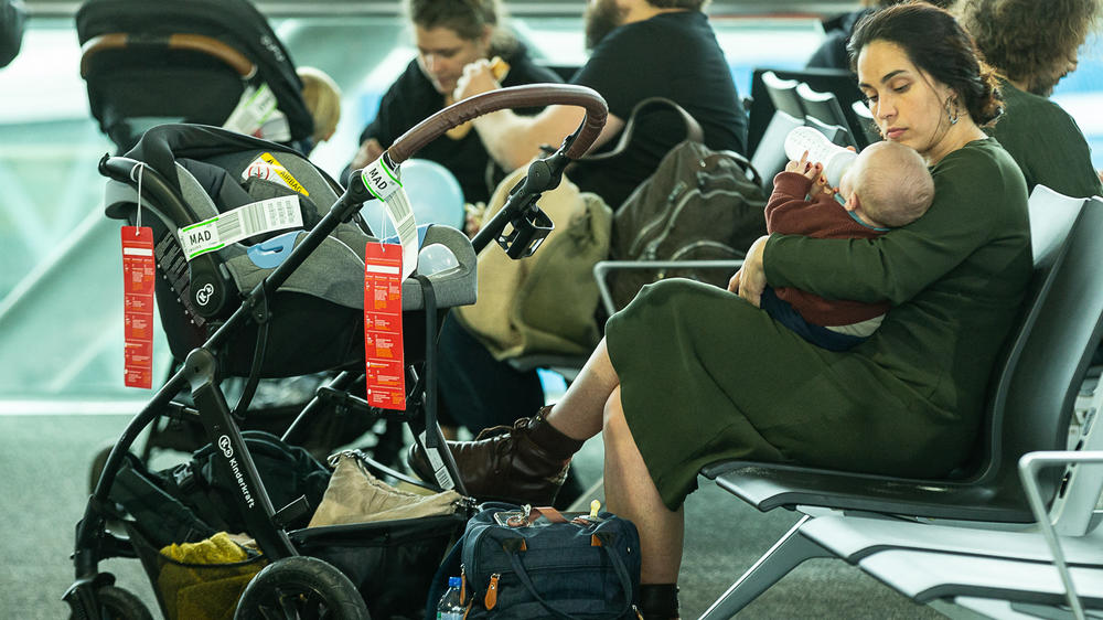 A mother with her baby in the transit zone of terminal A at Brussels Airport, in Zaventem, on November 4, 2022.