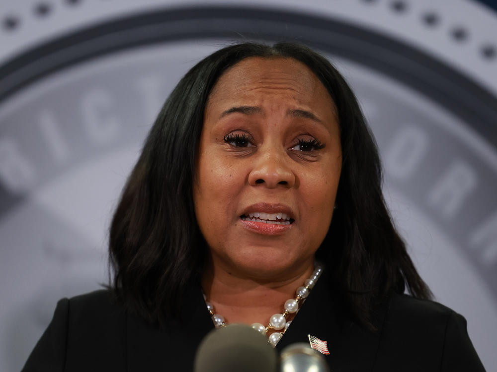 Fulton County District Attorney Fani Willis speaks during a news conference in Atlanta on Aug. 14.