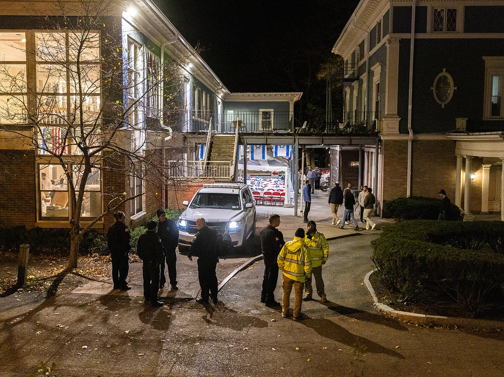 Police and security stand outside the Center for Jewish Living at Cornell University on Nov. 3 in Ithaca, New York. The university canceled classes after one of its students is accused of making violent antisemetic threats.