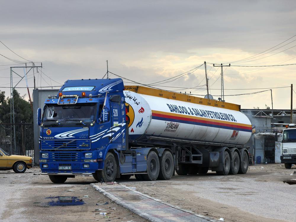 A truck carrying a limited delivery of fuel crosses into Rafah in the southern Gaza Strip on Wednesday. Israel has agreed to allow in a greater amount of fuel for humanitarian use.