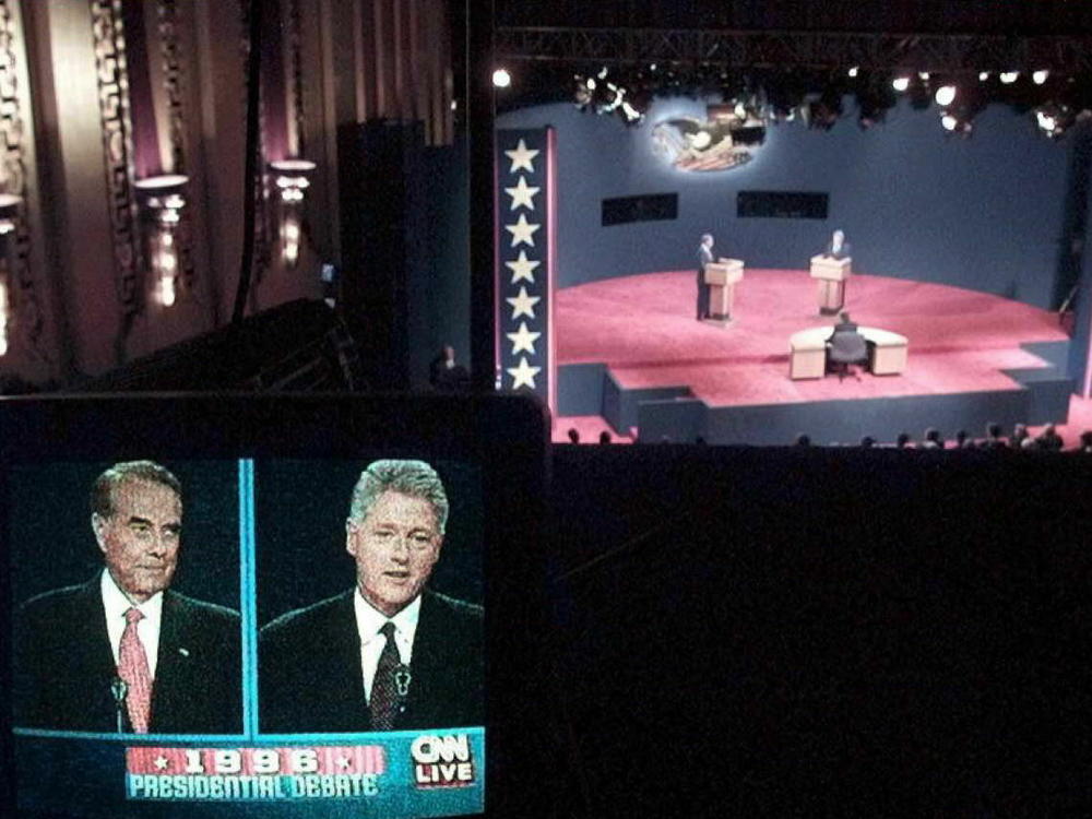 GOP presidential candidate Bob Dole (L) and President Bill Clinton (R) are shown on a television monitor during a debate between the two candidates in Hartford, Conn., in 1996.