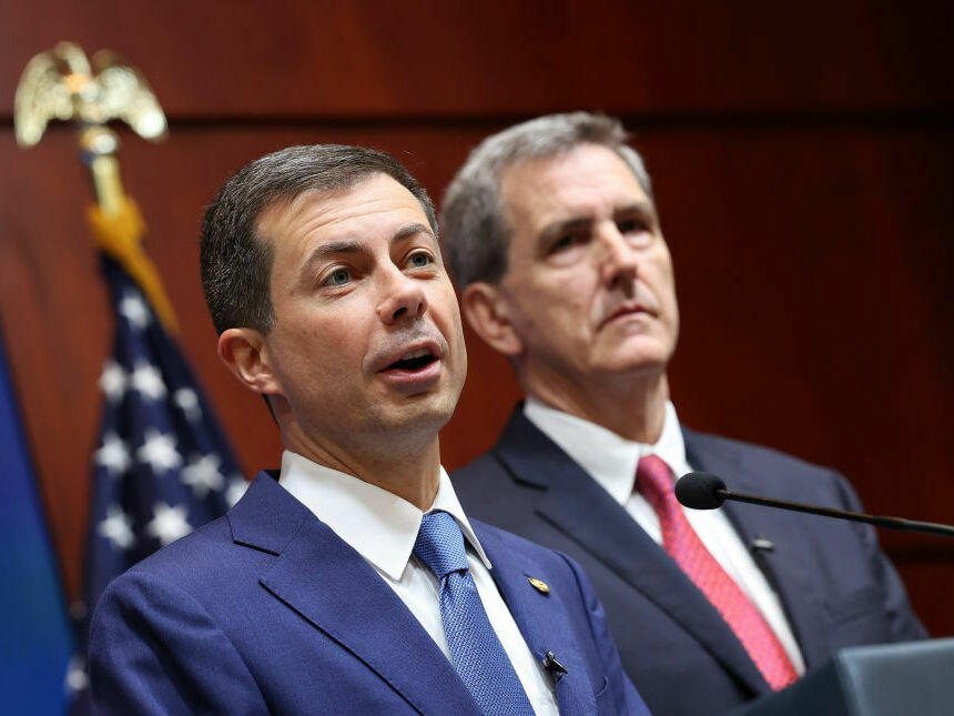 U.S. Secretary of Transportation Pete Buttigieg (left) and FAA Administrator Mike Whitaker at a press conference on Monday in Washington.