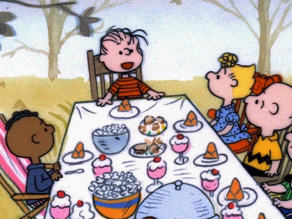 The <em>Peanuts</em> gang celebrates Thanksgiving, but why is Franklin by himself on one side of the table?