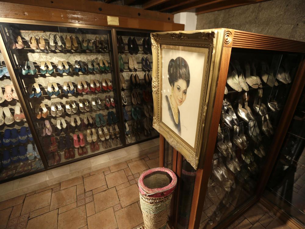 A portrait of former Philippine first lady Imelda Marcos adorns the Philippines' Marikina Museum, where more than 700 of her pairs of shoes are displayed, 2012.