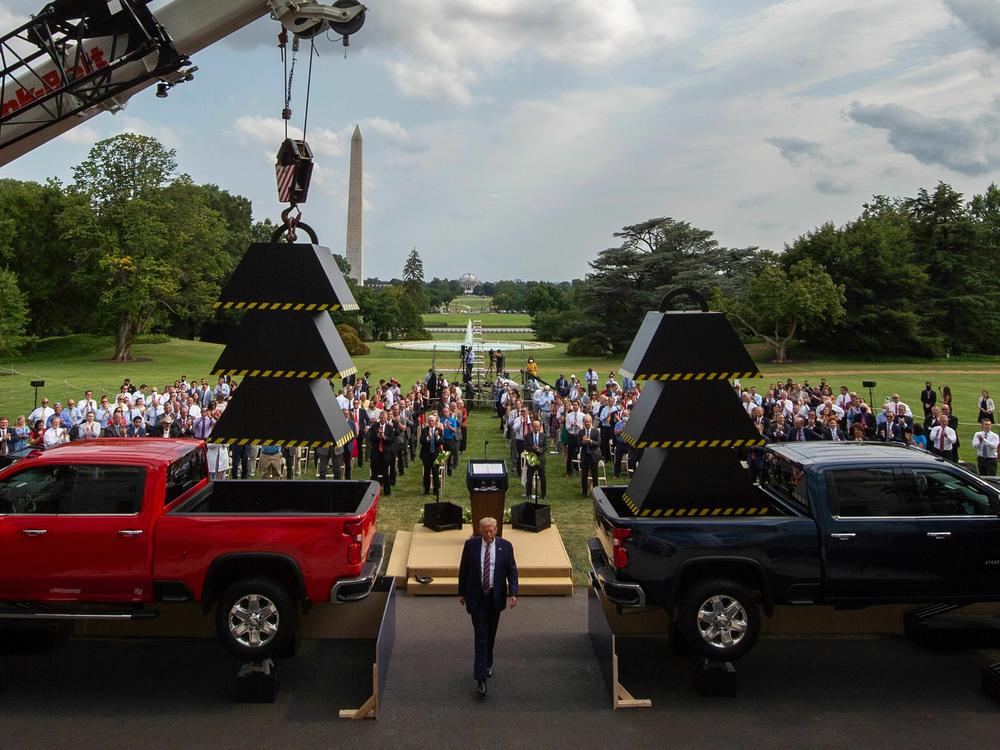 Then-President Donald Trump walks past weights and a crane after delivering remarks at the White House in July 2020.