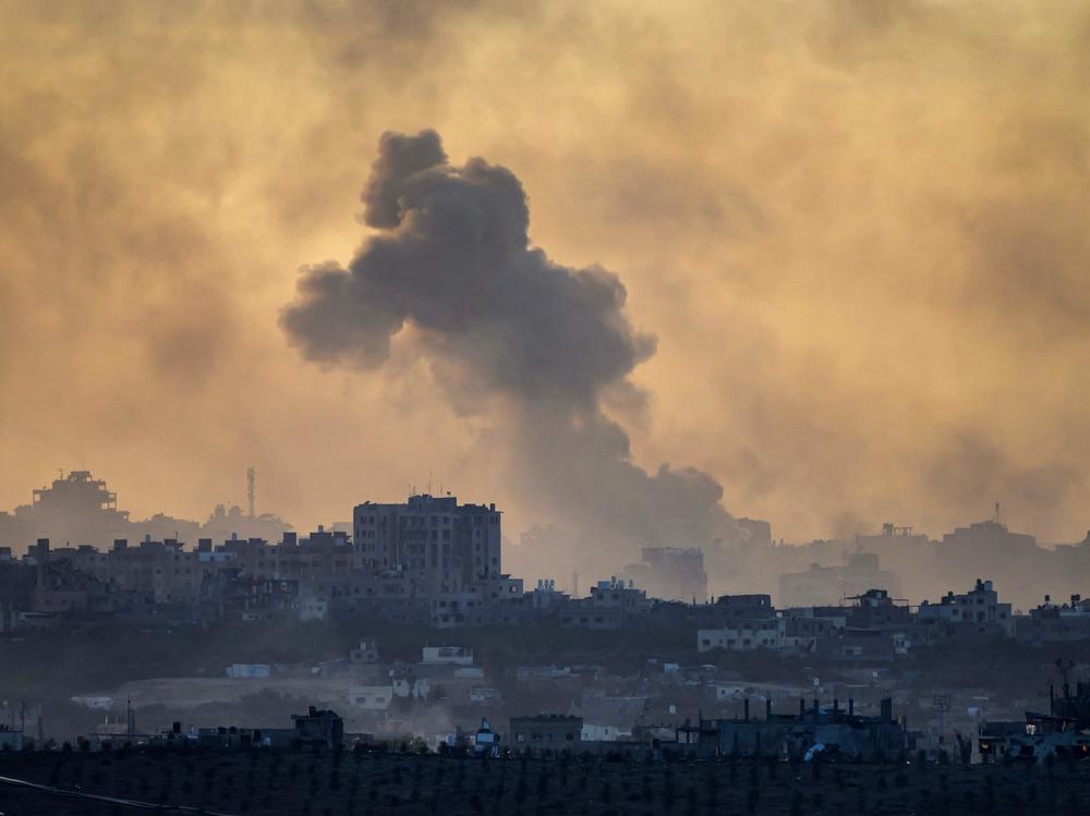 This picture taken from a position in southern Israel near the border with the Gaza Strip shows smoke billowing in the the Palestinian territory after an Israeli strike on November 21, 2023, amid ongoing battles between Israel and the Palestinian Hamas movement.
