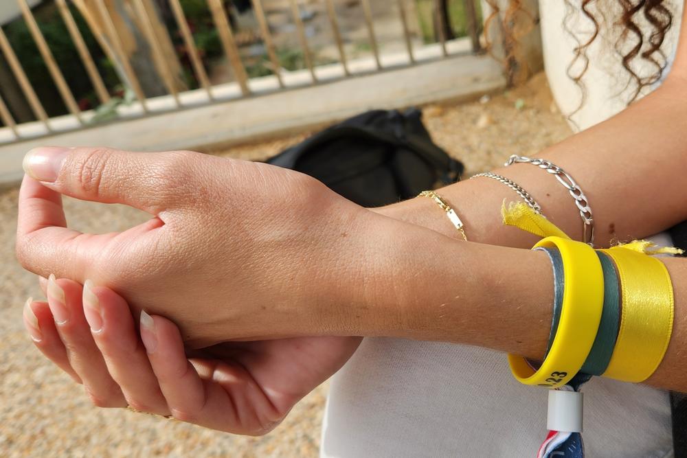 Yarden Gonen wears hope bracelets that say 